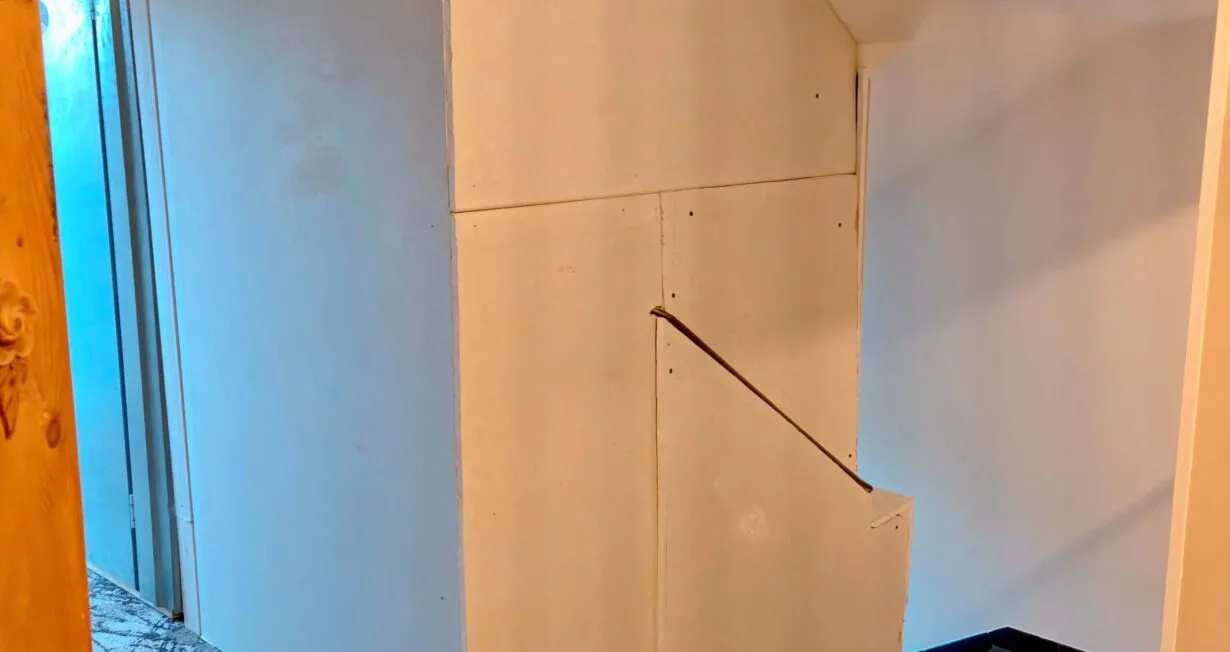 Bare plasterboard panels in the 5th-floor stairwell at Hotel Kraft Munich