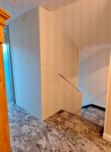 Bare plasterboard panels in the 5th-floor stairwell at Hotel Kraft Munich